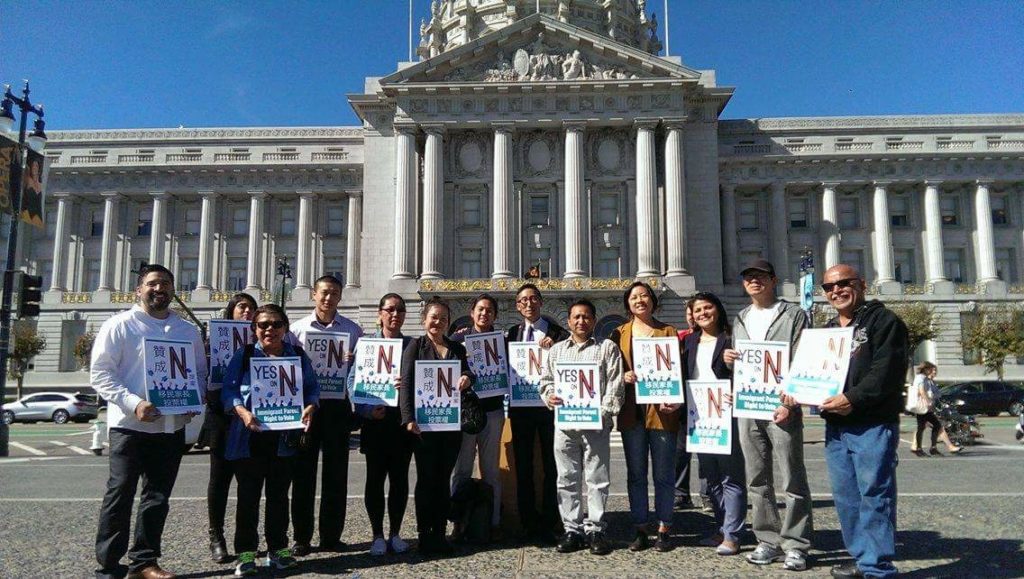 CAA allies hold Yes on Prop N banners outside the State Capitol in Sacramento.